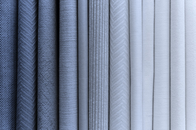 Blueish fabric stacks textured background